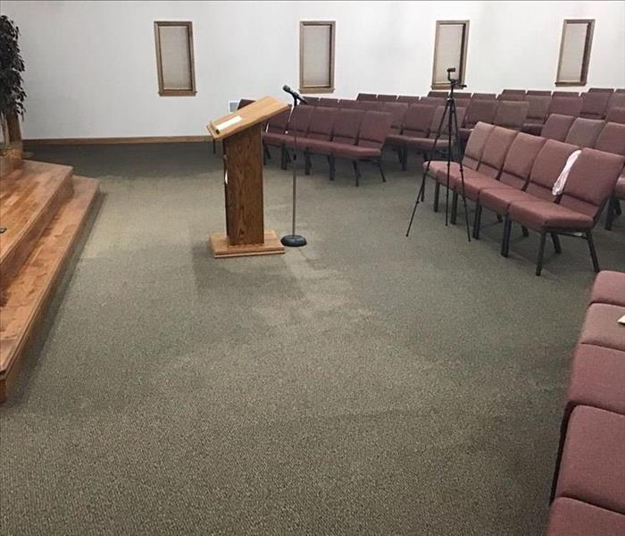 Sanctuary with wet carpet due to backup