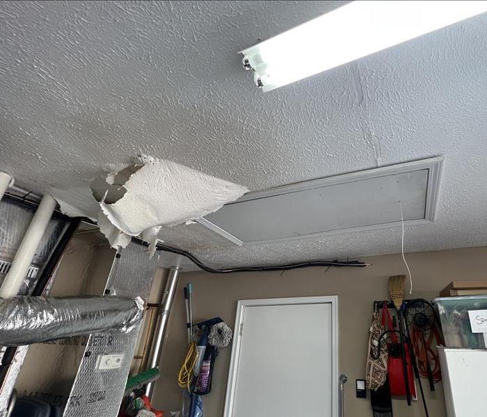 Garage ceiling bowed from water damage